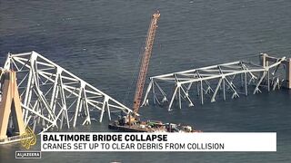 Baltimore bridge collapse_ Cranes set up to clear debris from collision.