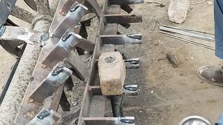 Thresher machine cutters are being installed