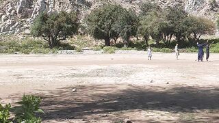 Village kids playing cricket
