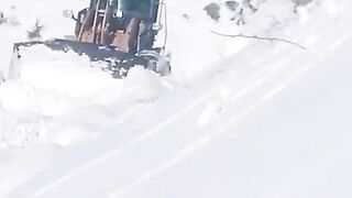 Machine Removing snow from road