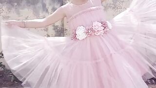 Little girl playing with her dress and posing like a wow