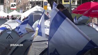 Protesters camped outside Israeli Knesset maintain pressure on Netanyahu to quit.