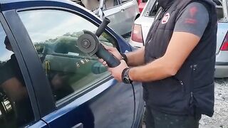 Experiment in window glass of car with grinder