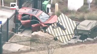 Vehicle crashes into front gate of FBI office in Atlanta.