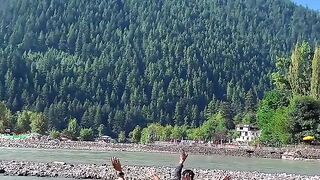 Occupied Kashmir People of Azad Kashmir are shaking hands with each other on the river bank
