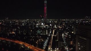 Iluminated Tower in a City at Night