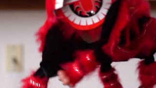 A Dancing Lion Puppet In Strings