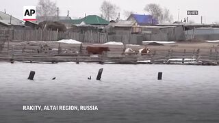Dozens of villages flooded in Russia's Altai region.
