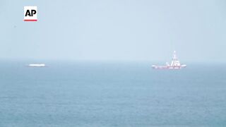 Open Arms ship in aid convoy for Gaza approaches shore.