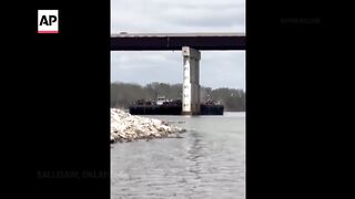 Barge collides with bridge in Oklahoma.