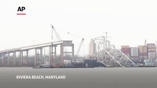 Floating crane arrives at wreckage of Baltimore bridge collapse.
