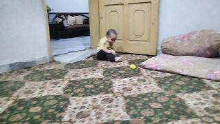 A baby boy enjoying and playing with his family
