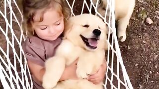girl holding a puppy