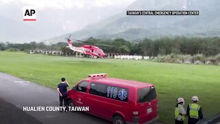 Rescue teams airlift workers to safety after Taiwan earthquake.