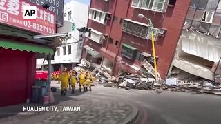 Taiwan firefighters rush to the scene to rescue people trapped after strong earthquake.