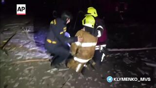 Ukrainian rescuer cries over the death of his father.