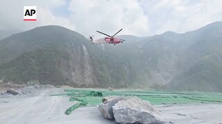 Rescue helicopter airlifts quarry worker in Taiwan after earthquake.