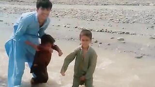 Kids playing in river