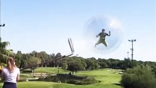 a group of people are playing a giant round of golf