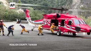 Rescue teams search for family feared trapped in rockslide in Taroko Park following Taiwan quake.