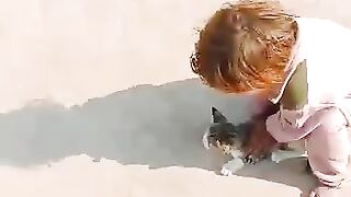 Child loving with Cat