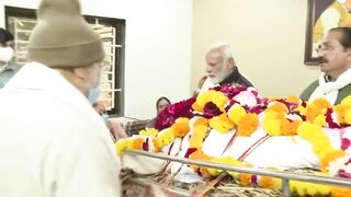 PM Modi carries the mortal remains of his late mother Heeraben Modi in Ahmedabad, Gujarat