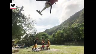 Rescuers airdrop aid to elementary schools in Taiwan after quake.