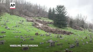 Mudslide washes out about 100 tombstones at West Virginia cemetery.