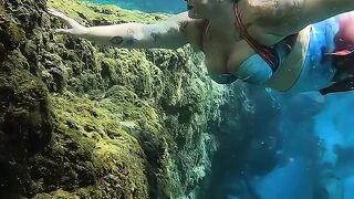 Video of a girl swimming under the sea