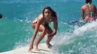 A girl surfs professionally