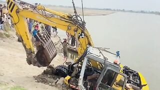 The submerged machine in the river Sutlej is being pulled out