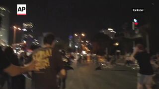 Speeding car knocks over dozens of protesters in Tel Aviv.