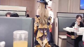 Anime beautiful Asian teen cosplaying at restaurant