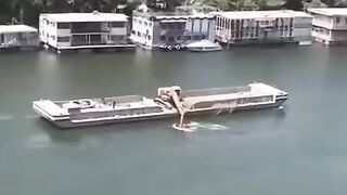 An excavator rowing in the Nile, Egypt.