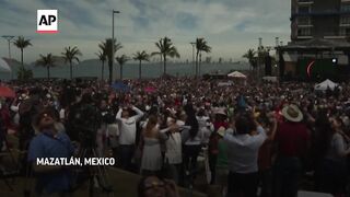 Spectators watch solar eclipse in Mexico.