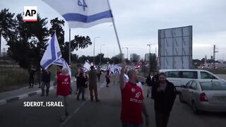 Israelis protest near Sderot, demanding the offensive against Hamas continues.