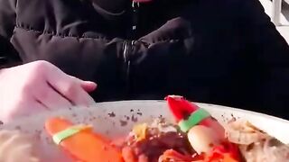 Chinese fisherman cooking and eating sea food
