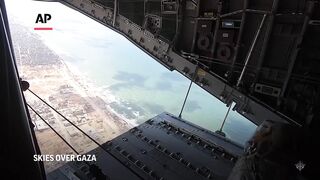 French military air drops humanitarian aid into Gaza Strip.