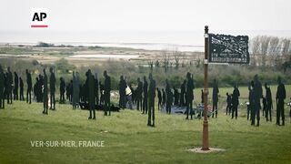 Workers prepare British war memorial in Normandy for D-Day commemorations.
