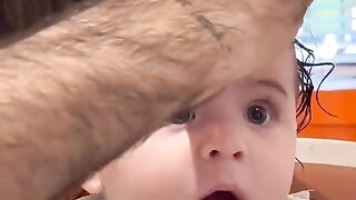Surprised Baby Hair Cutting