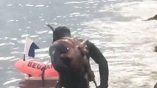 Man has an octopus stuck on his back