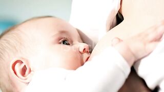 Sweet baby feeding mom milk