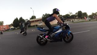 Crazy girl does motorcycle stunts on St. Louis streets