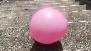Filled water ballon rolling down