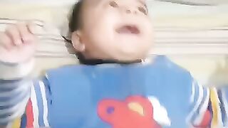 Cute Baby On the rock laughing