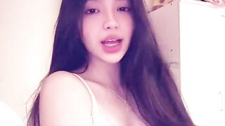 Asian teen in bedroom