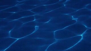 Wave's lines of light underwater in a pool - adalinetv