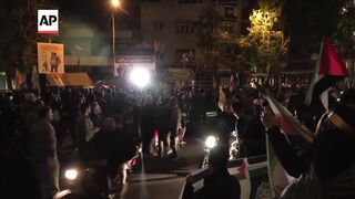 Hardliners celebrate in Tehran after Iran attacks Israel with missiles, drones.