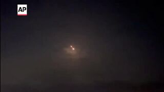 Iran attacks Israel_ Objects flying over the sky seen from West Bank.