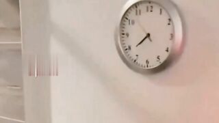 hidden camera inside the wall clock in the bathroom